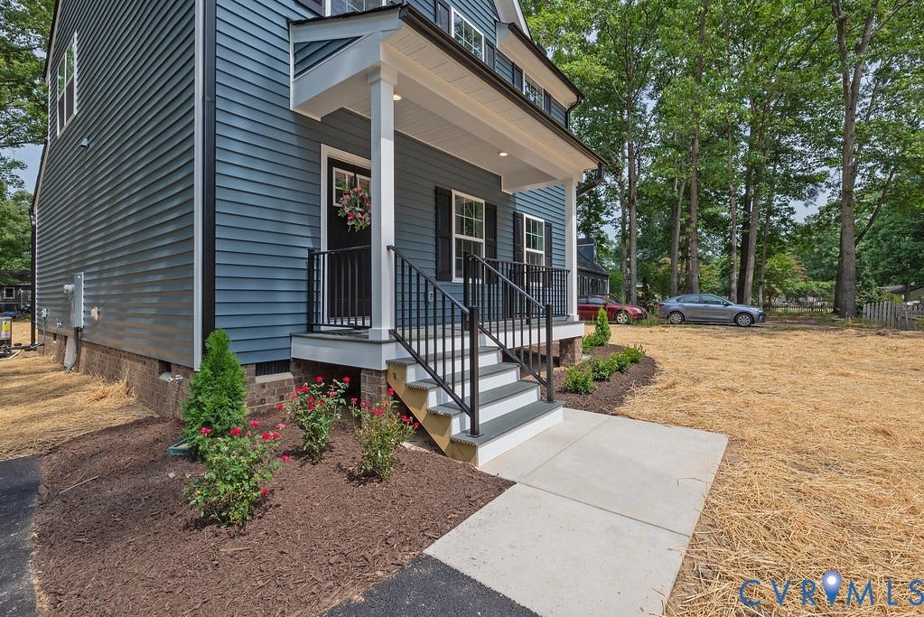 Blue siding exterior with white trim
