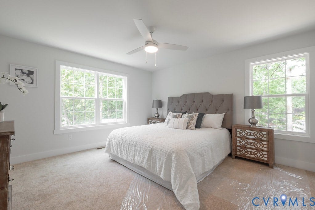 Recessed lighting, ceiling fan with light, and multiple large windows