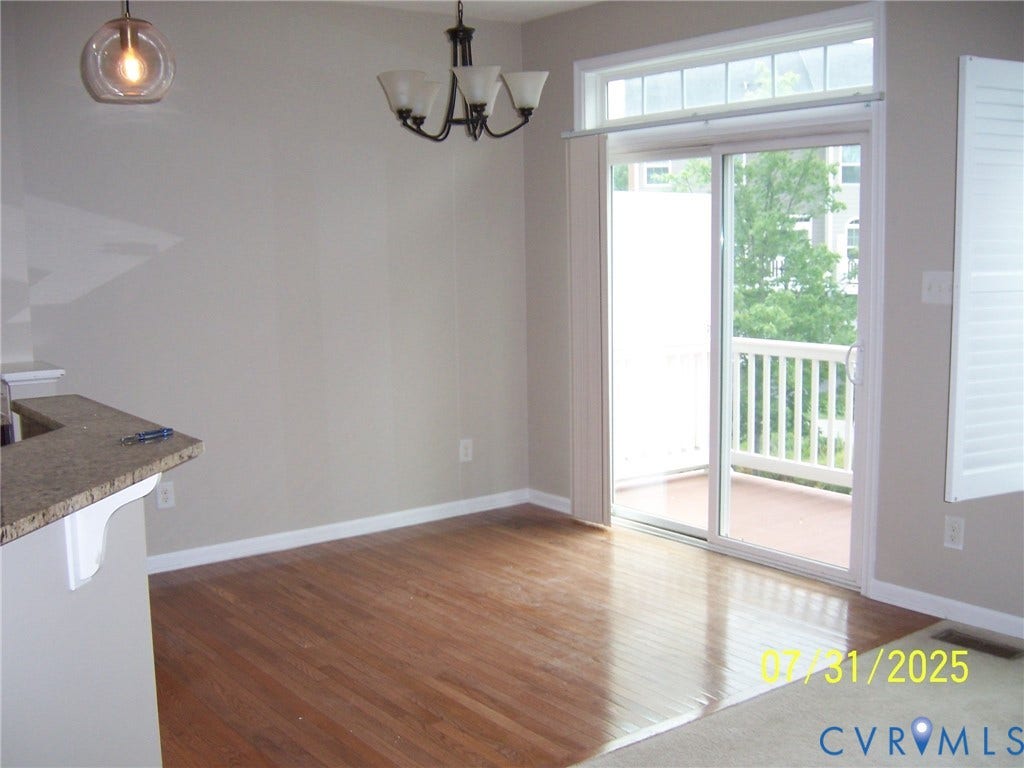 1805 Liesfeld Parkway, Henrico, VA 23060 Unfurnished dining area with wood finished floors and a chandelier