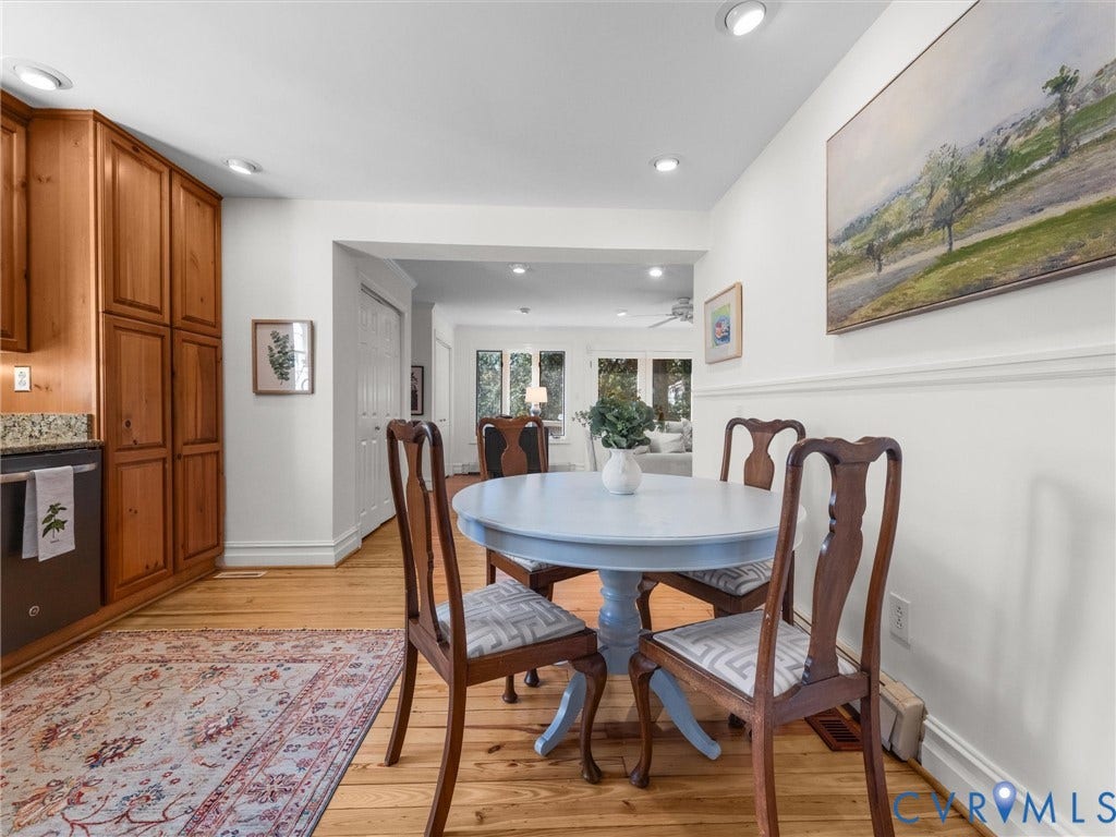Wood-finish flooring, recessed lighting, and chair rail molding