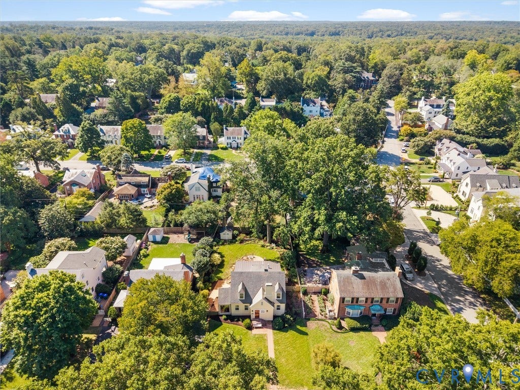 Expansive neighborhood featuring mature trees and established residences