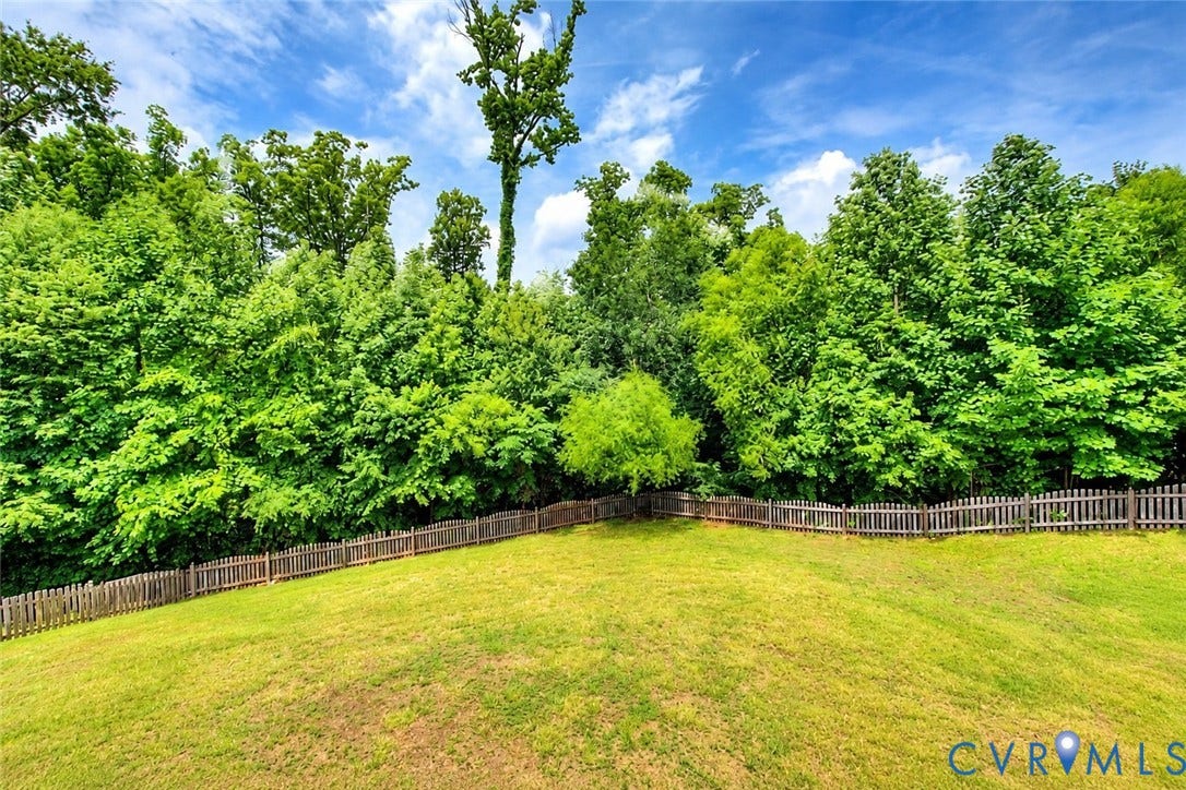 14812 Flour Mill Court, Flour Mill, Chesterfield, VA 23112 Fully fenced and lined with trees, the backyard feels like a secluded retreat.