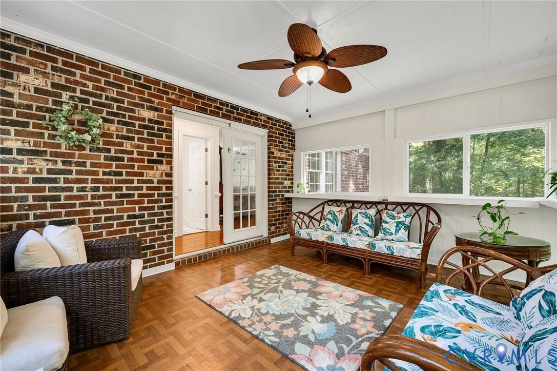 2409 Three Bridge Road, Rural, Powhatan, VA 23139 Brick accent wall, parquet flooring, white paneled ceiling, ceiling fan with light fixture, and multiple windows