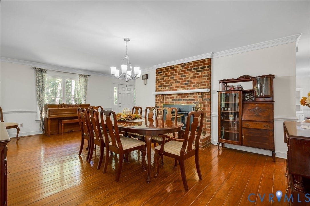 2409 Three Bridge Road, Rural, Powhatan, VA 23139 Hardwood flooring, brick fireplace with mantel, crown molding, chair rail molding, and a multi-pane window