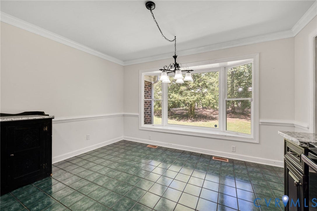 2409 Three Bridge Road, Rural, Powhatan, VA 23139 Bay window with Front Yard scenery, chandelier lighting, tile flooring, crown molding, and wainscoting