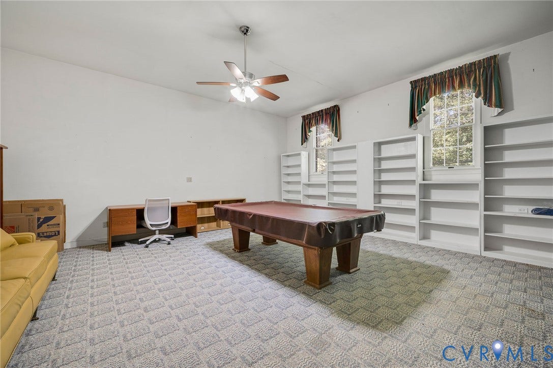 2409 Three Bridge Road, Rural, Powhatan, VA 23139 Vaulted ceiling with a ceiling fan, patterned carpet flooring, and two windows