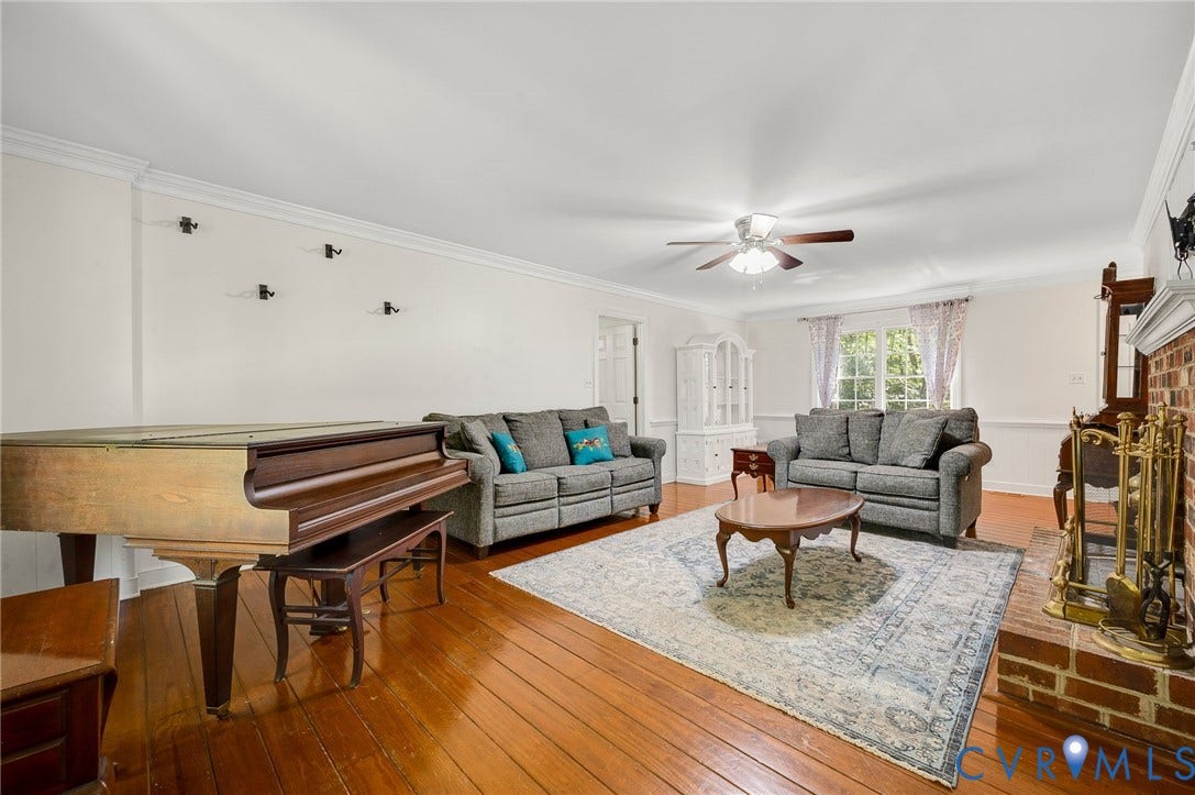 2409 Three Bridge Road, Rural, Powhatan, VA 23139 Hardwood flooring, crown molding, brick fireplace, ceiling fan, and recessed window