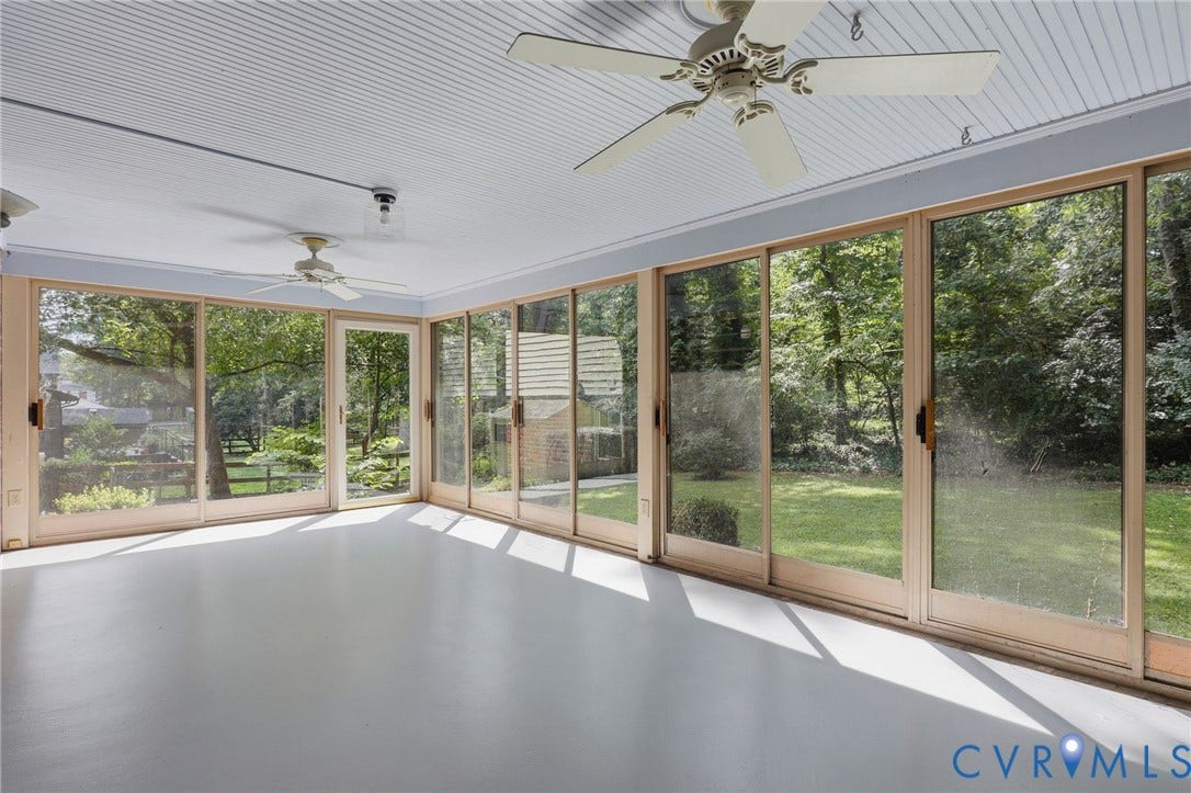 8349 Charlise Road, Oxford, Richmond, VA 23235 Expansive sunroom featuring full-height sliding glass panel doors, a white beadboard ceiling, two ceiling fans, and light-toned flooring
