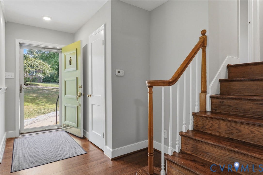 8349 Charlise Road, Oxford, Richmond, VA 23235 Hardwood flooring, recessed lighting, and a prominent staircase with wood newel posts and handrail