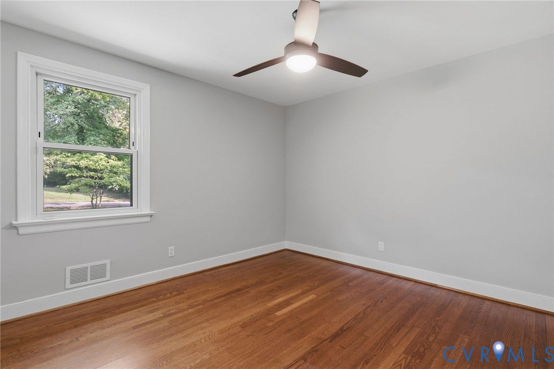 8349 Charlise Road, Oxford, Richmond, VA 23235 Refinished wood flooring and a contemporary ceiling fan with integrated lighting