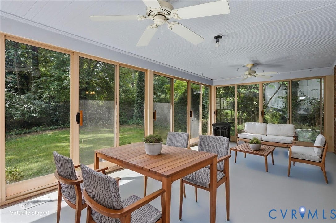 8349 Charlise Road, Oxford, Richmond, VA 23235 Enclosed patio featuring multiple ceiling fans, wood-frame sliding glass panels, and a painted floor