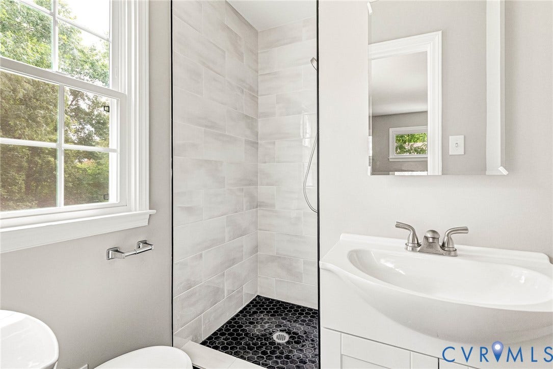1605 CLOISTER Drive, Henrico, VA 23228 Glass-enclosed shower with subway tile surround and dark hexagonal tile flooring
