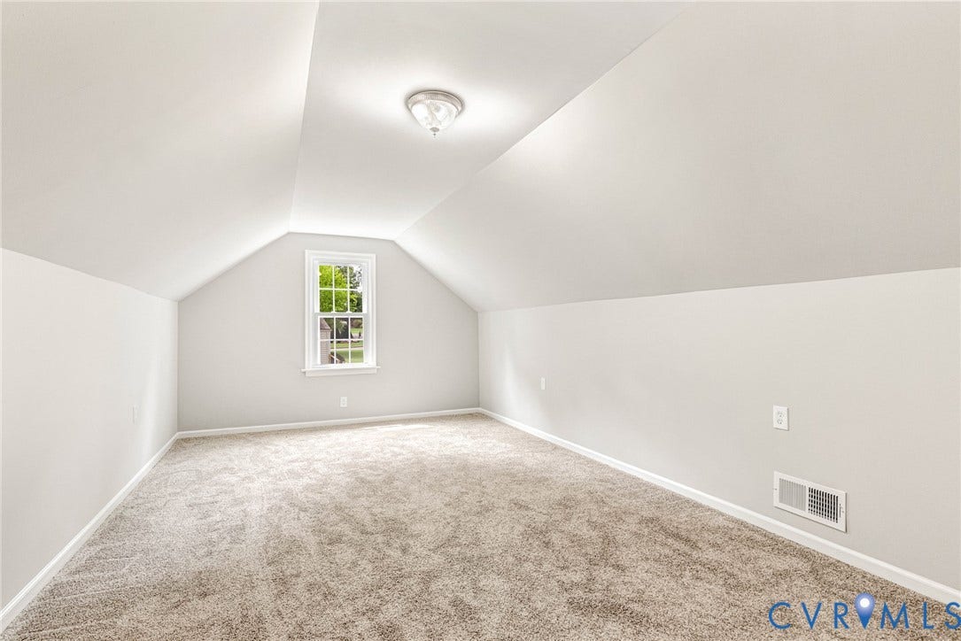 1605 CLOISTER Drive, Henrico, VA 23228 Carpeted room featuring sloped ceilings, a single-pane window, and a flush-mount ceiling light fixture