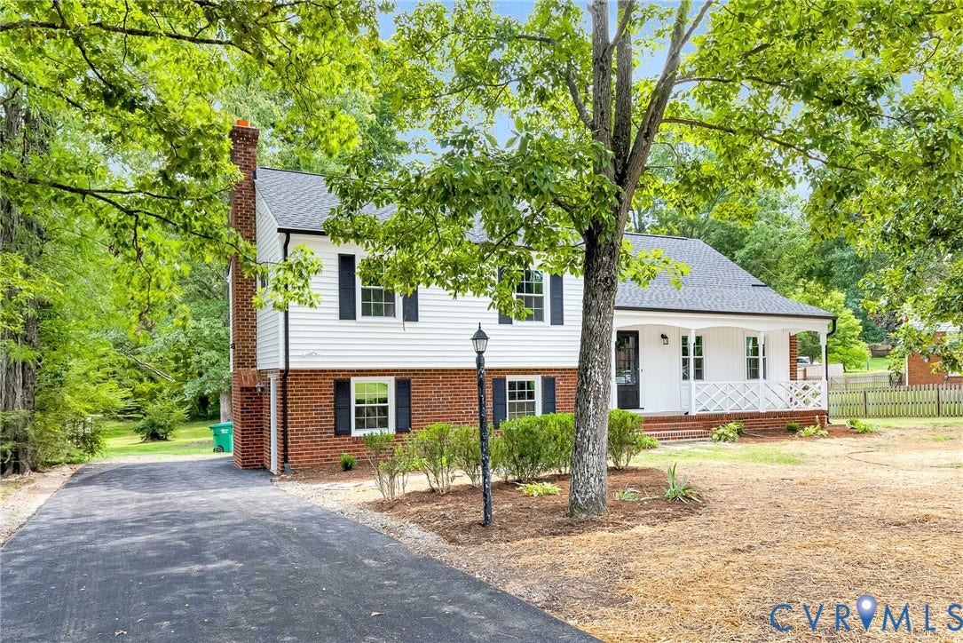 1605 CLOISTER Drive, Henrico, VA 23228 Brick and siding exterior with a covered porch, asphalt driveway, and mature trees