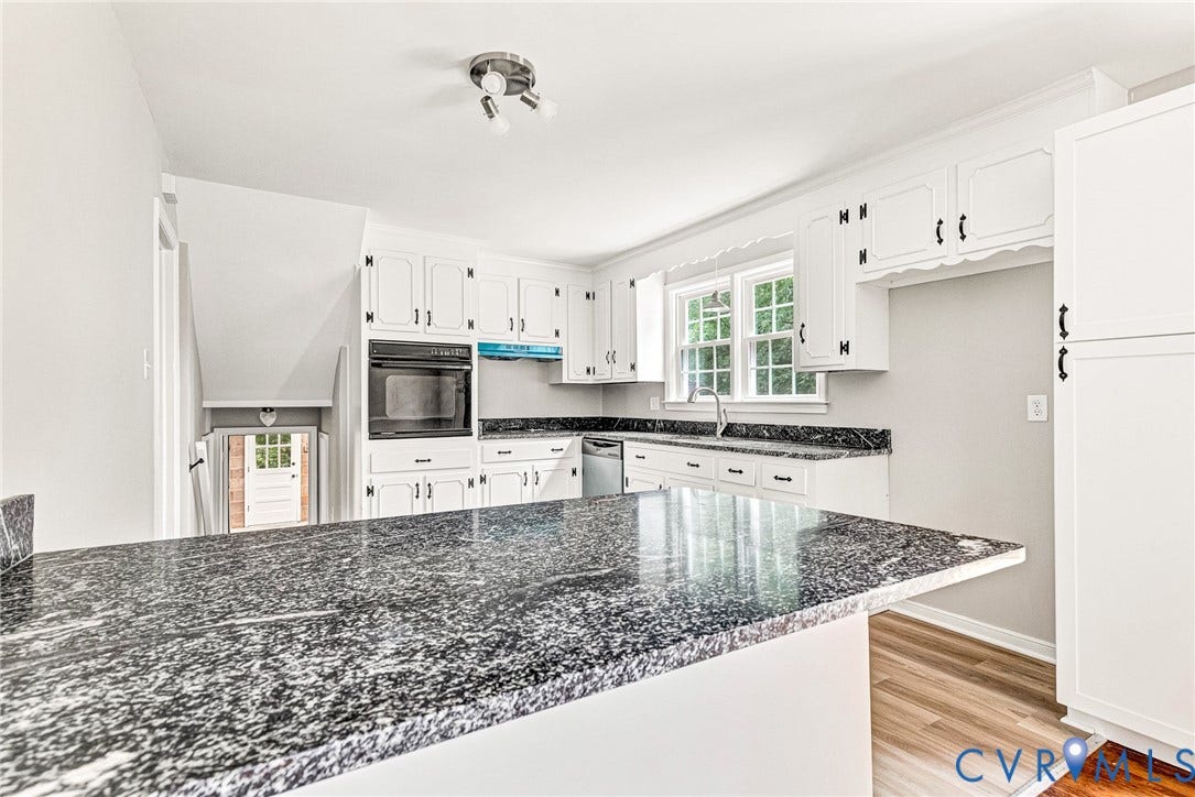 1605 CLOISTER Drive, Henrico, VA 23228 Kitchen featuring granite countertops, white cabinetry with black hardware, built-in microwave, and wood-finish flooring