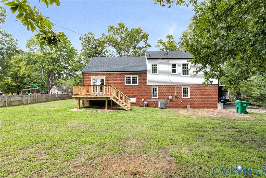 1605 CLOISTER Drive, Henrico, VA 23228 Expansive green lawn with a newly constructed wood deck and stairs