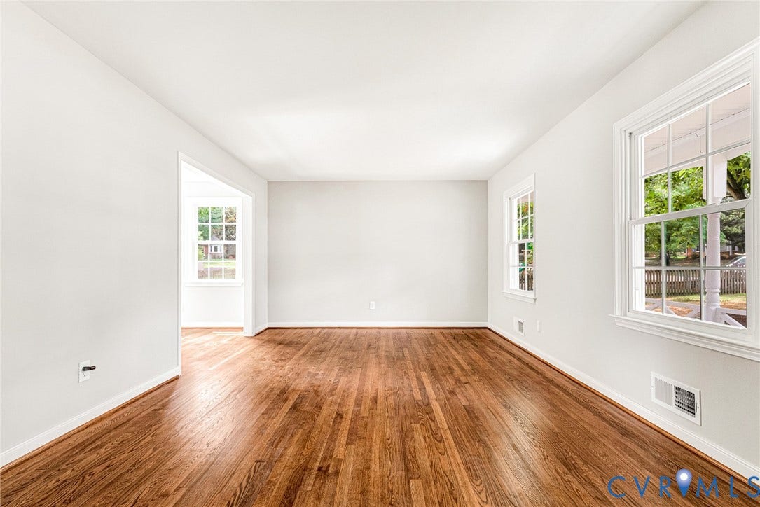 1605 CLOISTER Drive, Henrico, VA 23228 Hardwood-finish flooring throughout, white painted walls, white window trim, and a wide doorway