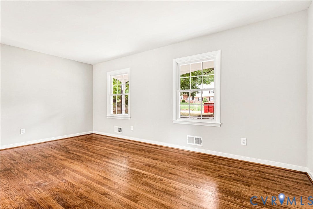 1605 CLOISTER Drive, Henrico, VA 23228 Hardwood flooring, painted walls, two windows with white trim, and a high ceiling