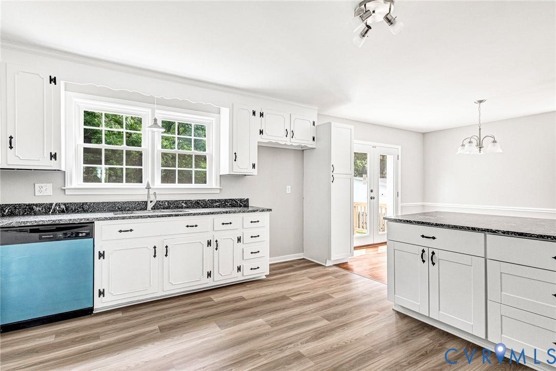 1605 CLOISTER Drive, Henrico, VA 23228 Kitchen with white cabinetry, dark speckled countertops, wood-finish flooring, and a large center island