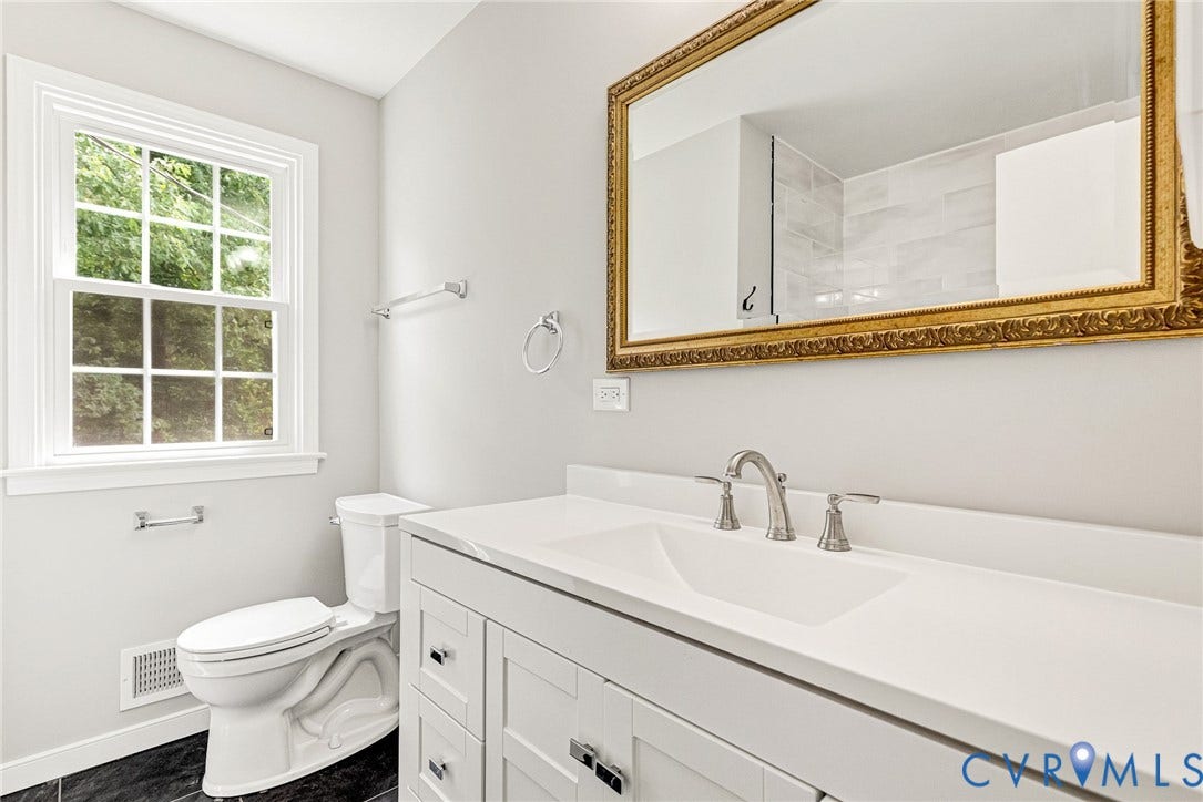 1605 CLOISTER Drive, Henrico, VA 23228 White vanity with shaker-style cabinetry, an integrated sink, and brushed nickel fixtures