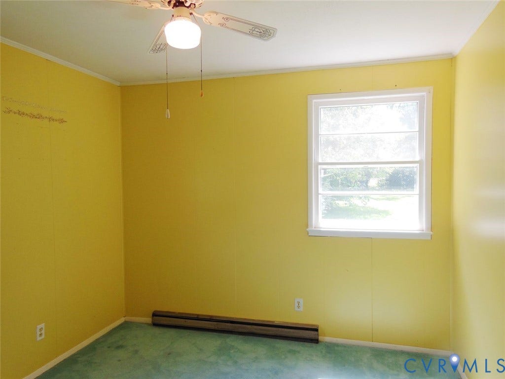 1805 Naselle Lane, Henrico, VA 23228 Bedroom # 2 - Ceiling fan light fixture, double-hung window, baseboard heating unit, wall paneling