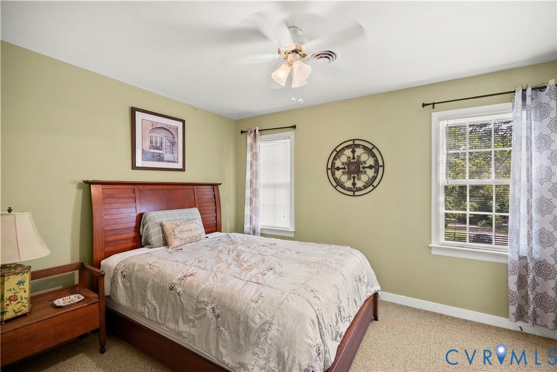 Recessed lighting, ceiling fan, two windows, and carpeting