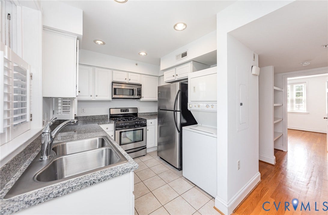 24 W Locke Lane, #1, Richmond, VA 23226 Kitchen featuring white cabinetry, stainless steel appliances, a double basin sink, and stone-look countertops