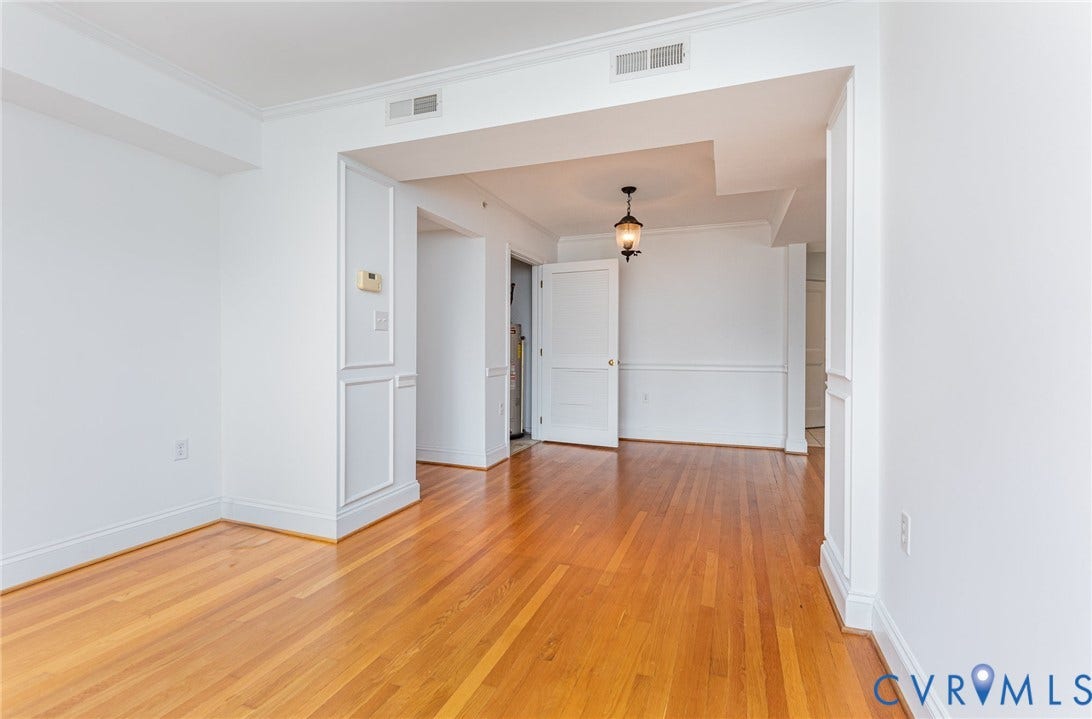 24 W Locke Lane, #1, Richmond, VA 23226 Hardwood flooring, crown molding, wainscoting, recessed lighting, and a decorative pendant fixture