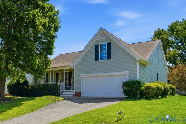 Light-hued siding exterior with a partial covered porch