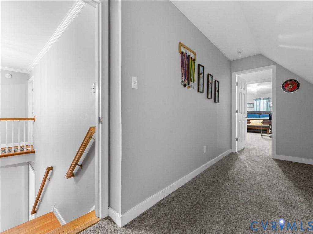 3489 Richards Run, Powhatan, VA 23139 Hardwood stair treads, white painted railing, crown molding, and gray carpeting