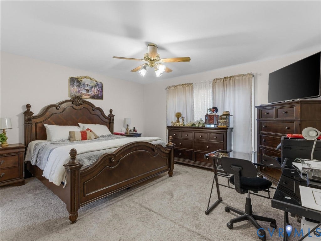 3489 Richards Run, Powhatan, VA 23139 Carpeted bedroom with a ceiling fan, dual windows, and ample wall space