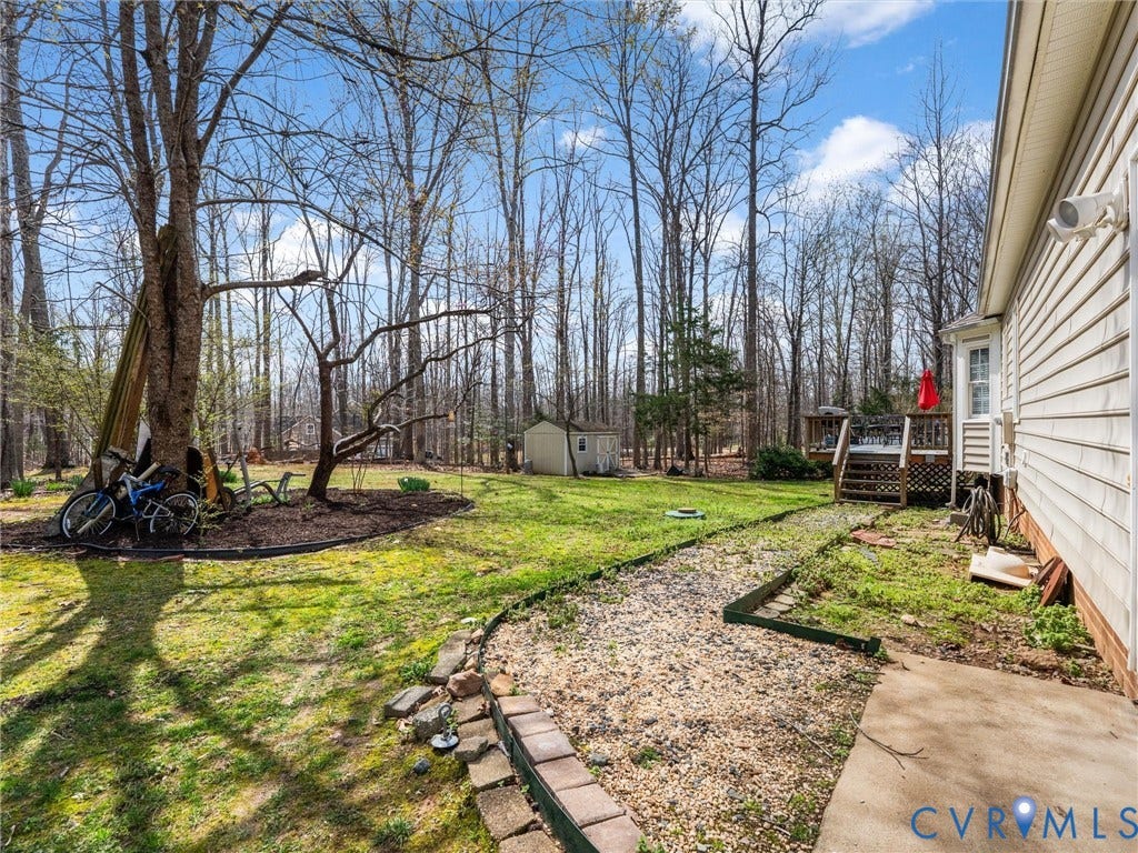 3489 Richards Run, Powhatan, VA 23139 Hardscaped gravel pathway leading to a multi-level wood deck