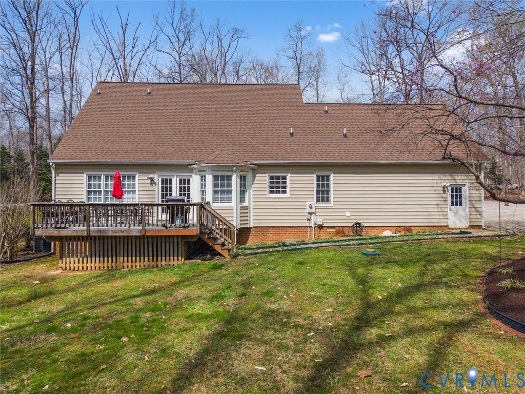 3489 Richards Run, Powhatan, VA 23139 Expansive rear decking, multiple egress points, bay window, and a natural wood-finish door