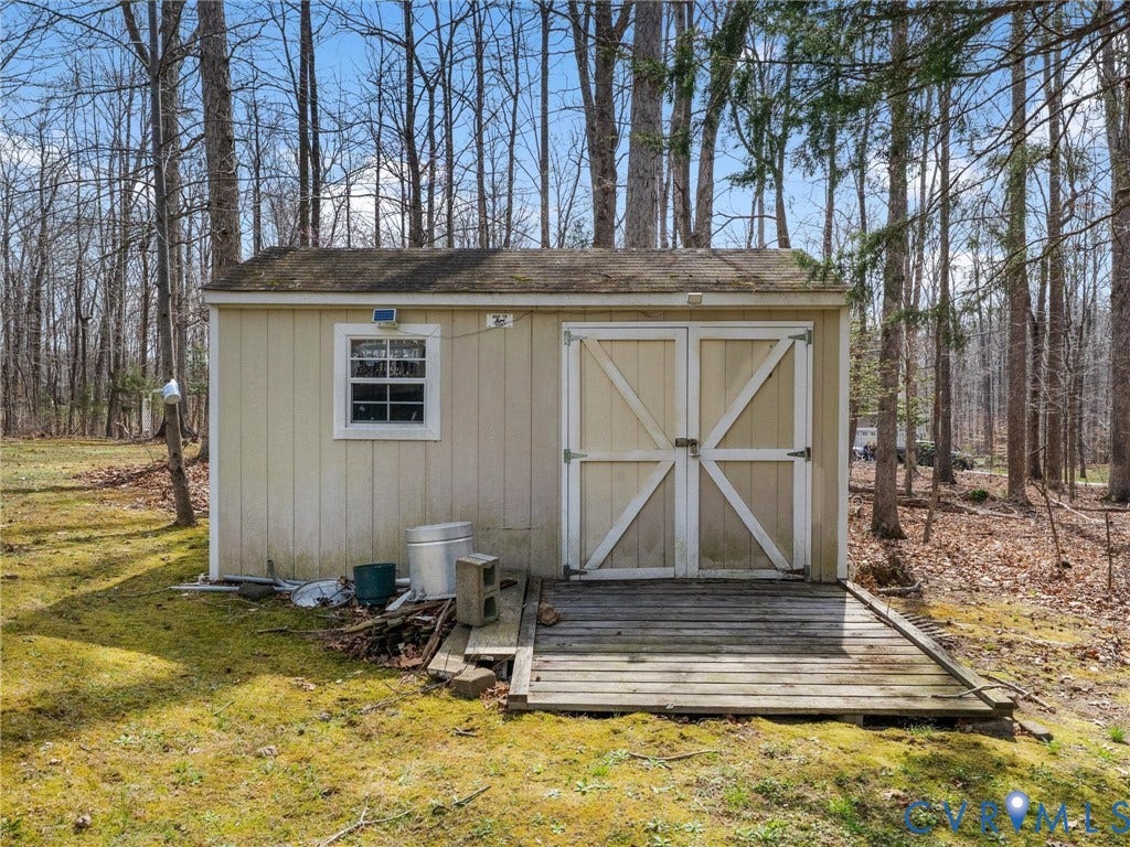 3489 Richards Run, Powhatan, VA 23139 Detached storage shed with double doors, a single window, and a wood-plank ramp