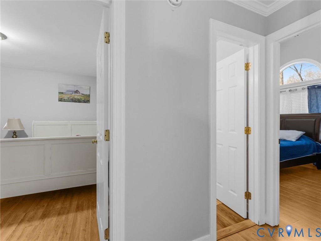 3489 Richards Run, Powhatan, VA 23139 Solid wood flooring throughout, paneled interior doors, and arched window