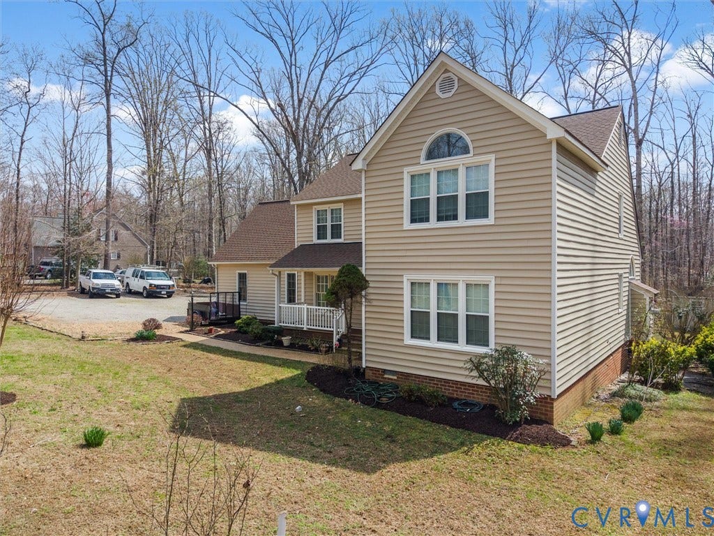 3489 Richards Run, Powhatan, VA 23139 Two-story residence featuring light-colored siding and a gabled roofline