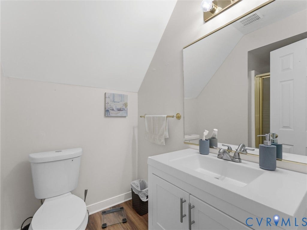 3489 Richards Run, Powhatan, VA 23139 White vanity with integrated sink, chrome faucet, and brushed nickel hardware