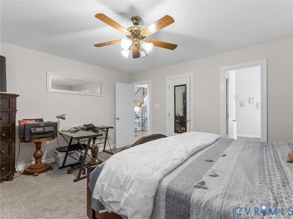 3489 Richards Run, Powhatan, VA 23139 Textured carpet flooring, ceiling fan with light fixture, light neutral wall color, and white trim