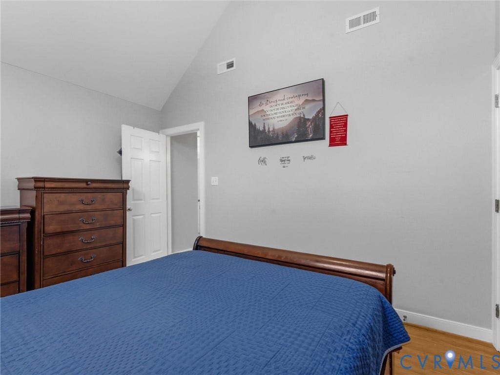 3489 Richards Run, Powhatan, VA 23139 Vaulted ceiling, light gray wall paint, white trim, wood-finish flooring, white paneled door