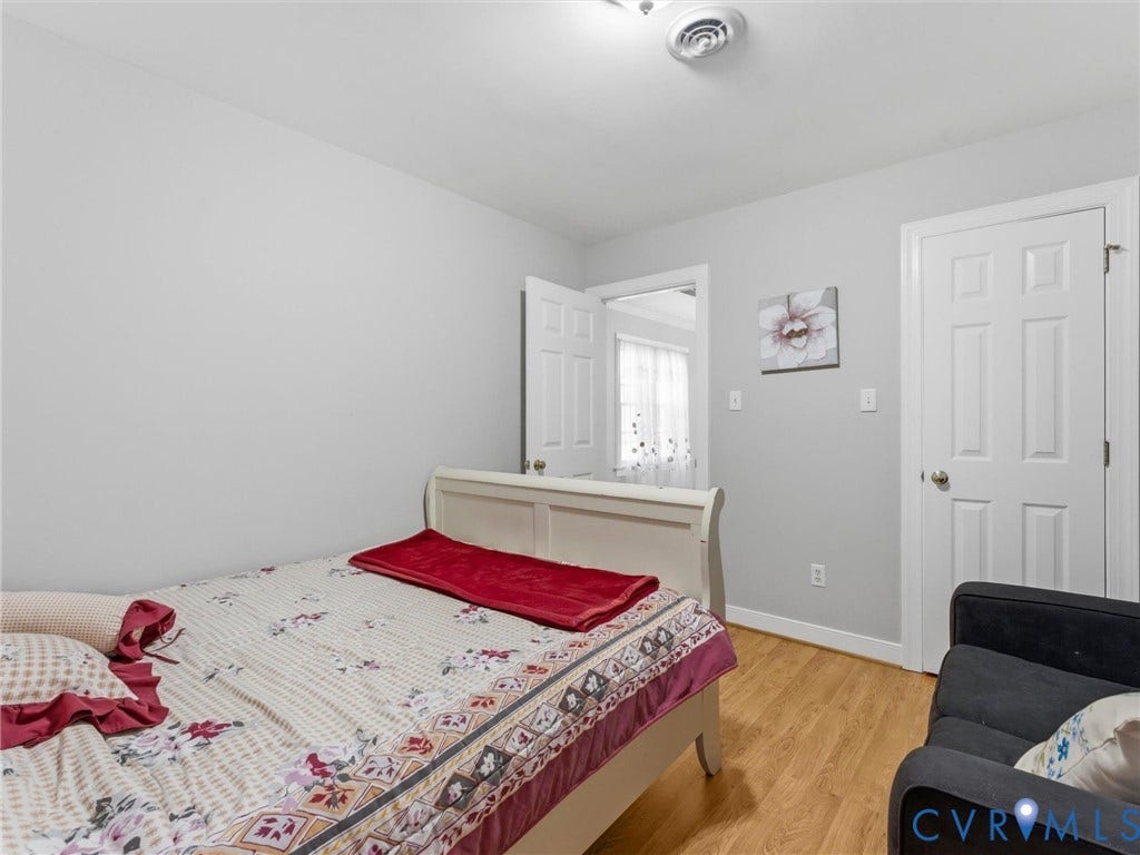 3489 Richards Run, Powhatan, VA 23139 Wood-finish flooring, white paneled doors, and light gray wall paint
