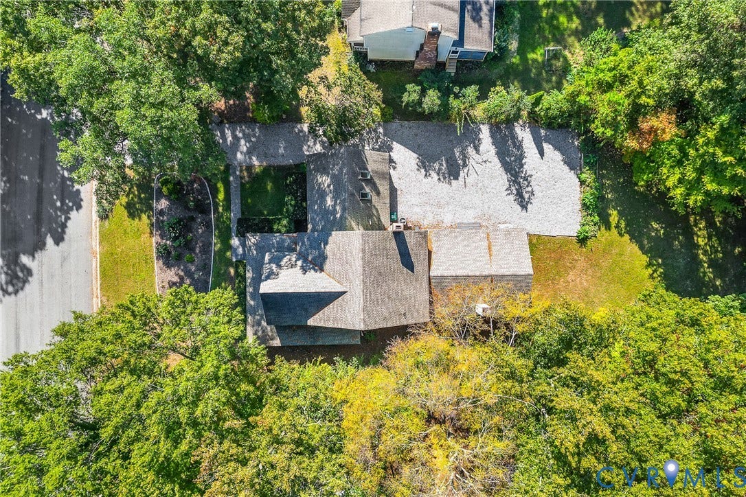 1608 Queens Point Drive, Henrico, VA 23238 Aerial perspective of a detached residence featuring a shingled roof, a stone driveway, and established tree canopy