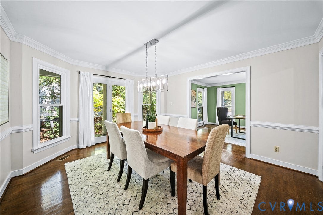 1608 Queens Point Drive, Henrico, VA 23238 Dining area featuring wood-finish flooring, crown molding, chair rail trim, and a multi-light chandelier