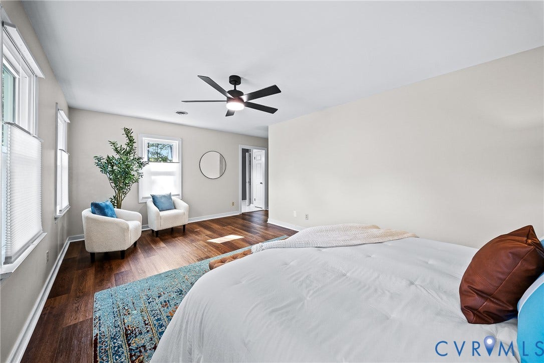 1608 Queens Point Drive, Henrico, VA 23238 Room featuring wood-finish flooring, a matte black ceiling fan with an integrated light fixture, and multiple windows