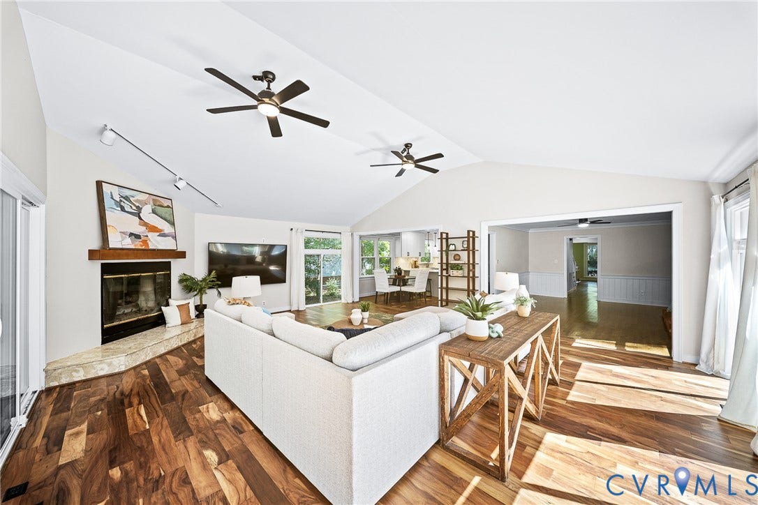 1608 Queens Point Drive, Henrico, VA 23238 Vaulted ceilings, wood-finish flooring, stone-surround fireplace with a timber mantel, recessed track lighting, and two ceiling fans