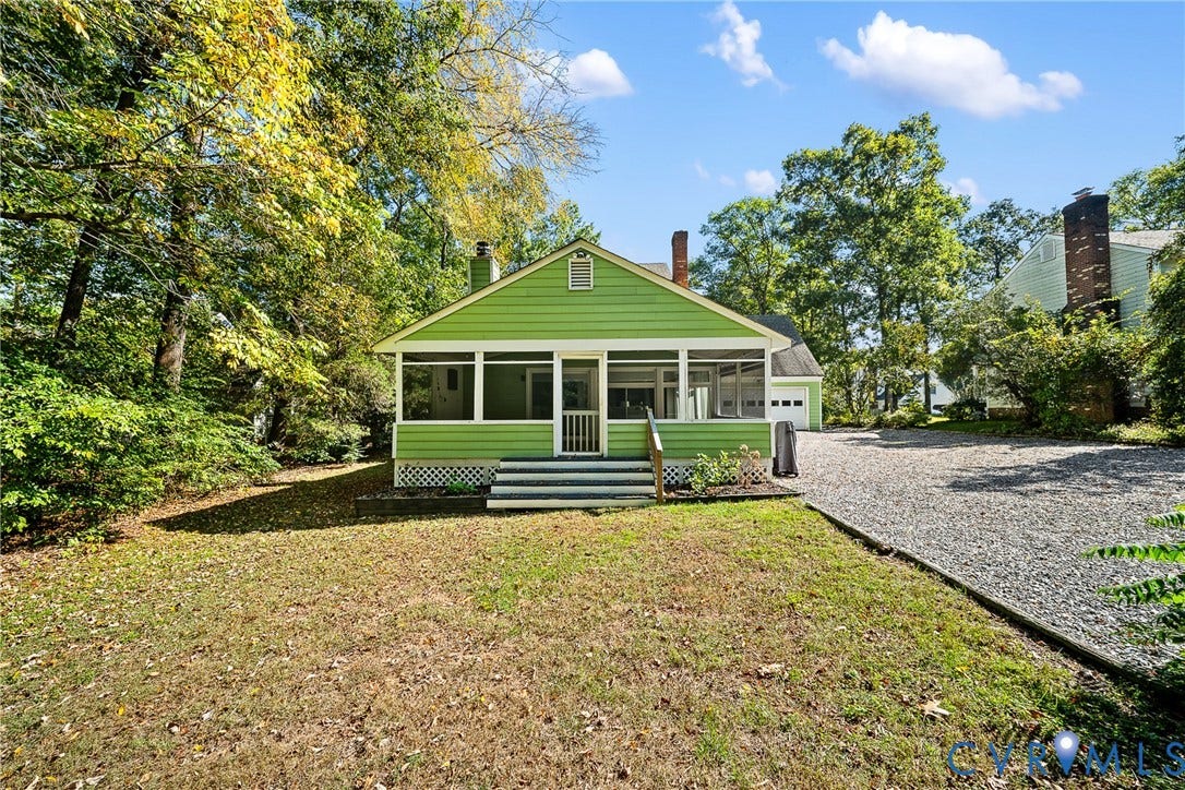 1608 Queens Point Drive, Henrico, VA 23238 Screened porch with lap siding, exterior brick chimney, gravel driveway, and mature perimeter trees