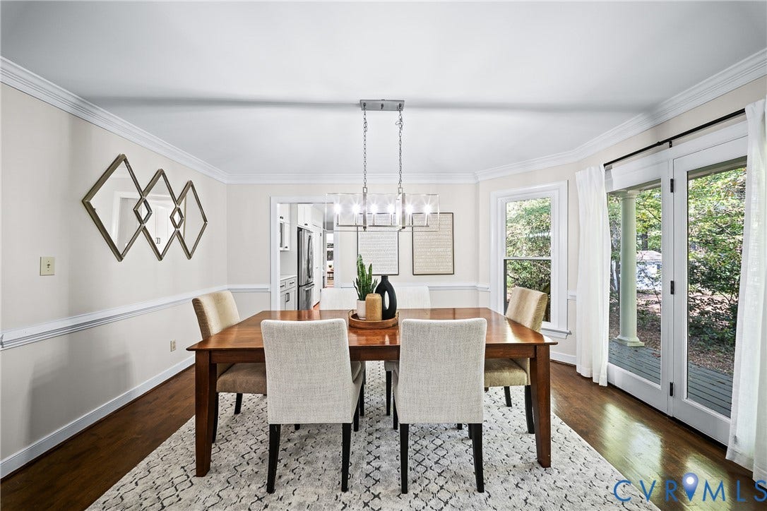 1608 Queens Point Drive, Henrico, VA 23238 Dining space featuring wood-finish flooring, crown molding, chair rail trim, a contemporary linear chandelier, and double glass doors providing exterior access