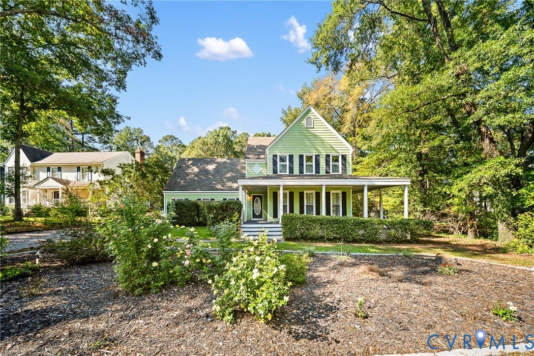 1608 Queens Point Drive, Henrico, VA 23238 Traditional two-story exterior featuring light-colored horizontal siding, a covered front porch, dark-toned shutters, and professional landscaping