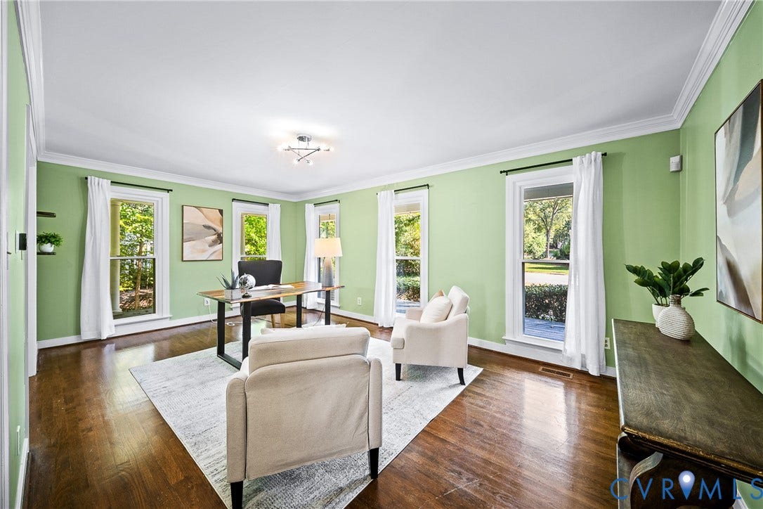 1608 Queens Point Drive, Henrico, VA 23238 Spacious room featuring wood-finish flooring, crown molding, and multiple tall windows providing abundant natural light
