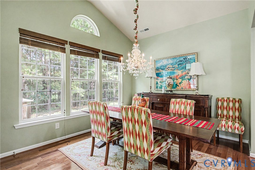 Dining Room Featuring Vaulted Ceiling.