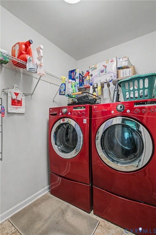 Laundry Room Featuring Tile Flooring, Washer/Dryer, and Extra Shelving.